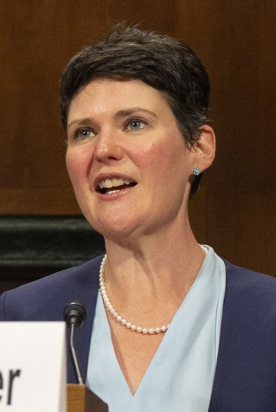 Amanda Tyler speaking at a microphone while testifying