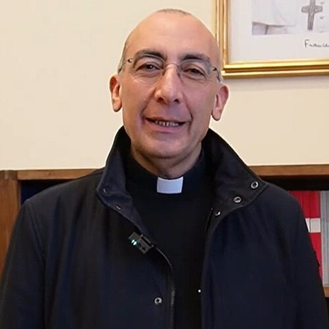 Cardinal Baldassare Reina in clerical collar and dark jacket