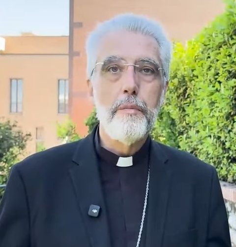 Archbishop Luis Marín de San Martín, grey-bearded, in clerical black with pectoral cross